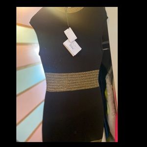 Sexy black and gold  mini dress never worn w/tags. Best offer. 💜